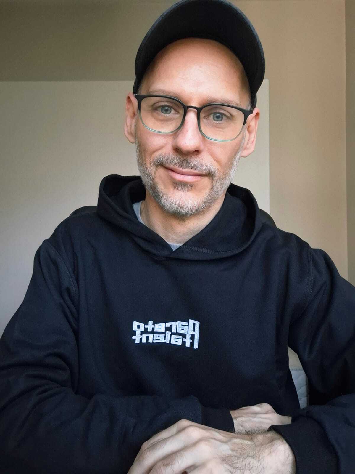 Pareto operator in a branded Pareto Talent hoodie